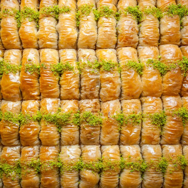 Top view turkish baklava pattern dessert made of thin pastry, nuts and honey