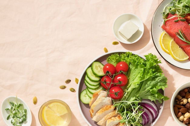 Top view of two plates with keto diet food and nuts