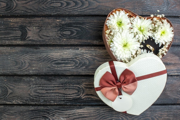 Free photo top view valentines day present with love note on a dark background marriage love couple feeling heart lover present holiday