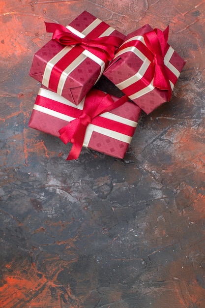 Top view valentines day presents with red bows on dark surface i love you photo color gift love feeling lover couple