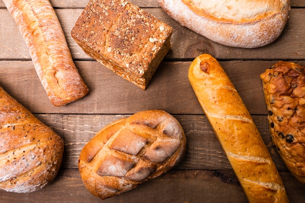 Top view variety of delicious breads on the table