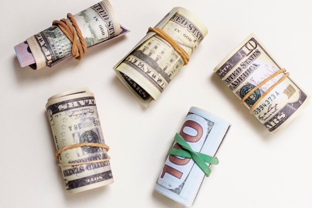 Free photo top view variety of rolled currency