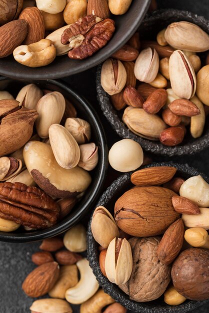 Top view various bowls filled with nuts