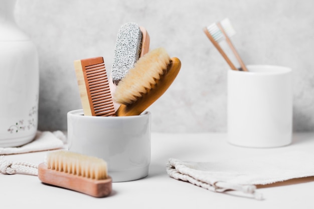 Top view various natural hair brushes in mug