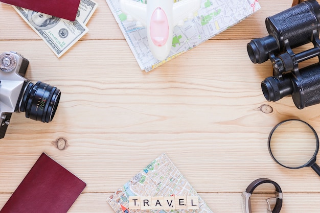 Free Photo top view of various traveler accessories on wooden backdrop