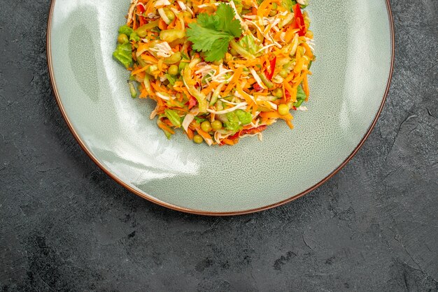 Top view vegetable chicken salad inside plate on dark floor health salad diet food