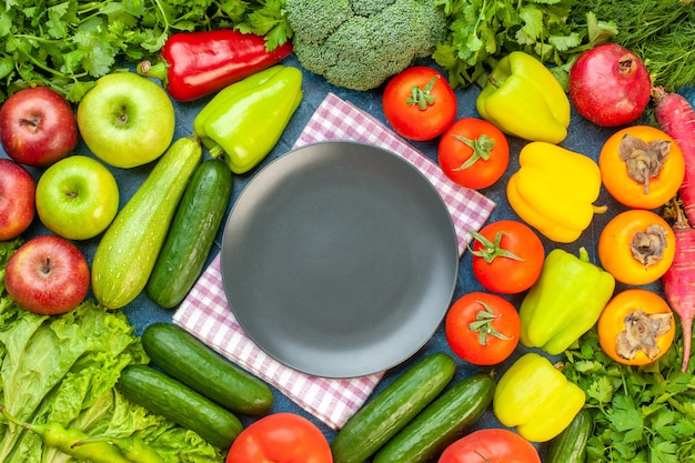 Top view vegetable composition with fresh fruits on blue table