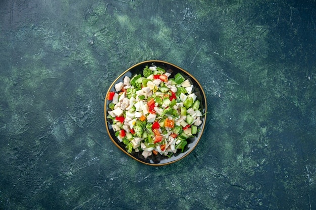 Free photo top view vegetable salad consists of cheese cucumbers and tomatoes on dark blue background color health lunch fresh food meal