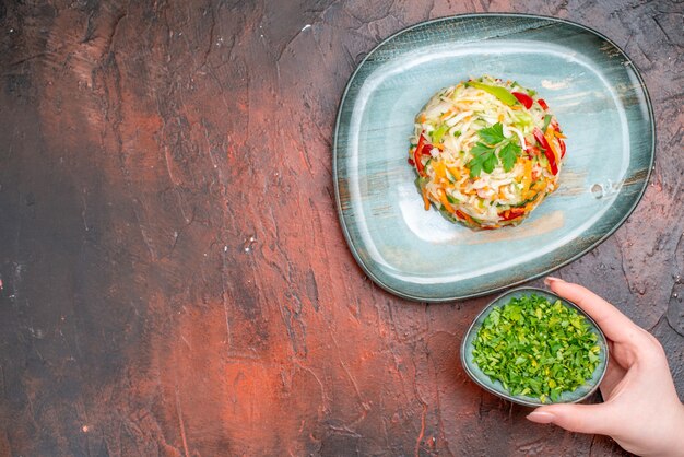 Top view vegetable salad round shaped inside plate on dark table color meal cuisine food healthy life ripe diet free space