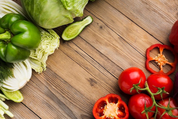 Top view vegetables assortment on wooden background with copy space