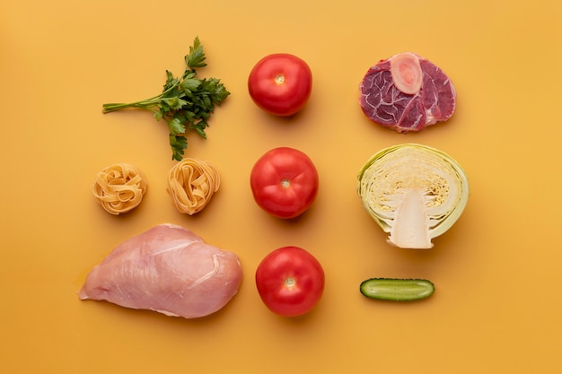 Free Photo top view vegetables and meat arrangement