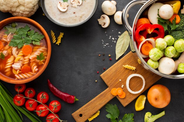 Top view vegetables in pan with vegetable soup with fusilli