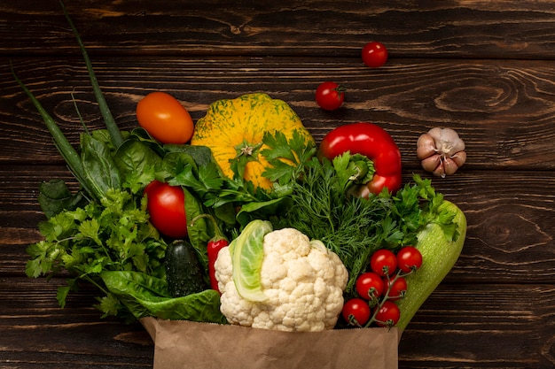 Top view vegetables on wooden background