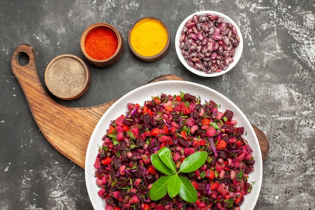 Free Photo top view vinaigrette salad with beet and beans on grey surface