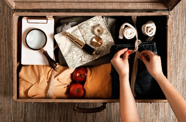 Free photo top view vintage suitcase with casual clothes