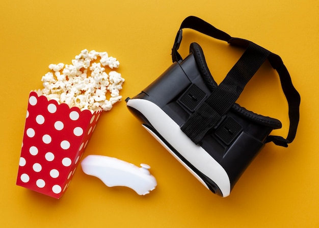 Top view virtual reality headset and popcorn