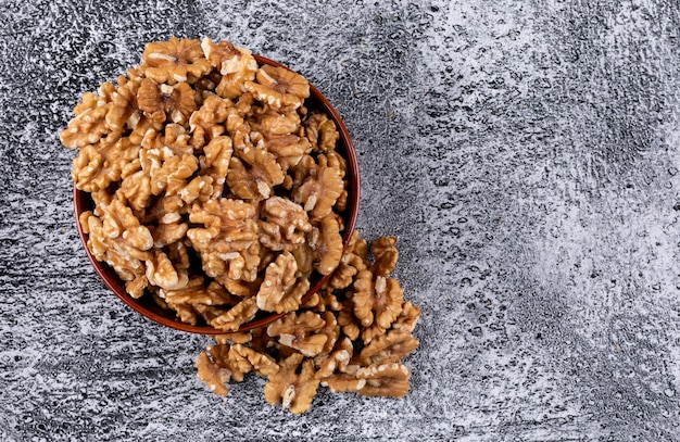 Top view walnuts in bowl on stone  horizontal