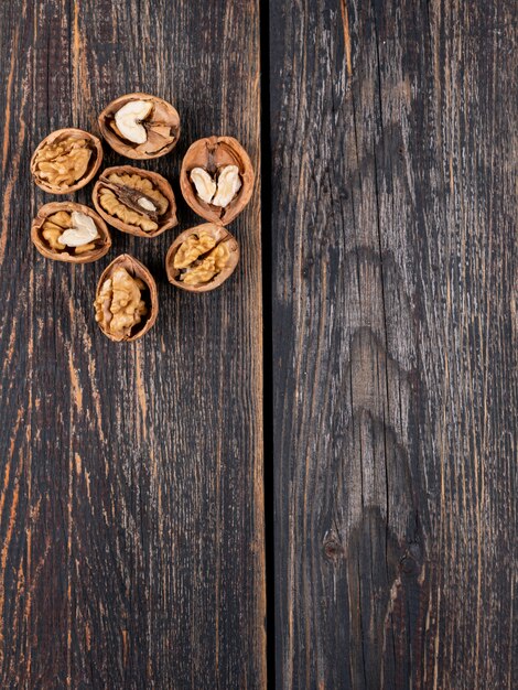 Top view walnuts with copy space on wooden  vertical