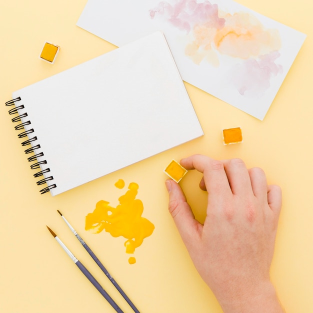 Top view watercolor with paint brushes on the table