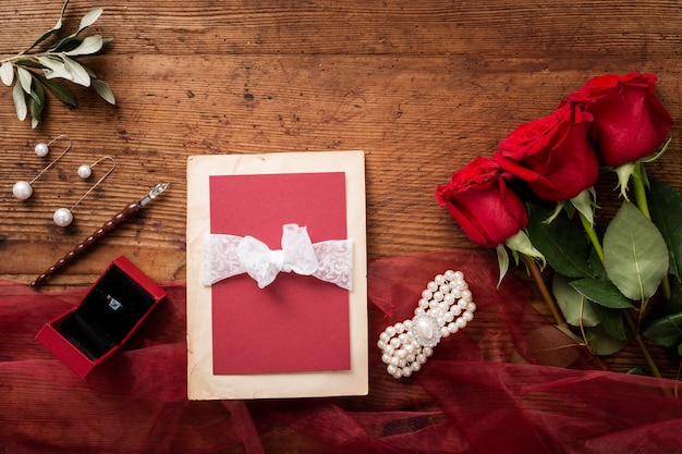 Top view wedding card and roses bouquet