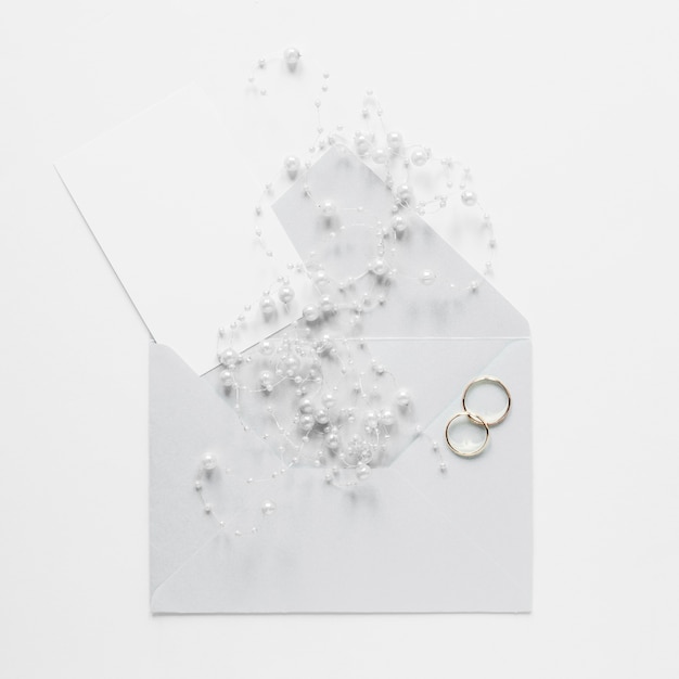 Free photo top view wedding card with engagement rings