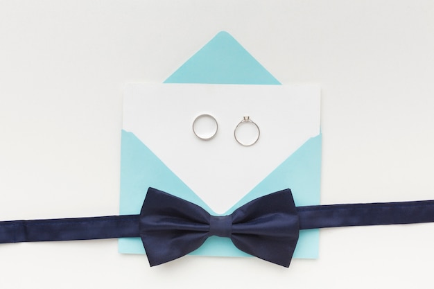 Free photo top view wedding engagement ring and bow