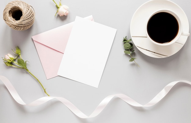 Top view wedding invitation with coffee beside