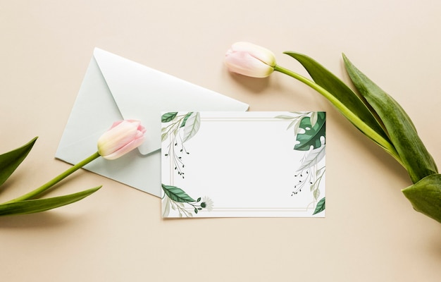 Top view wedding invitation with tulips beside