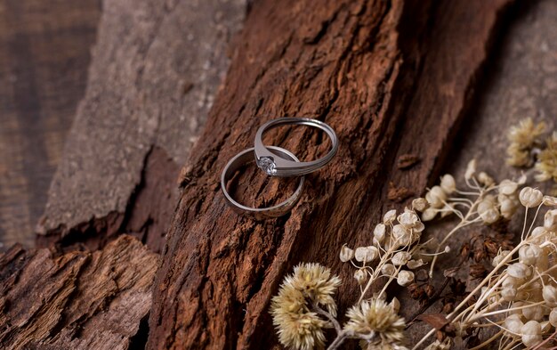 Top view wedding rings and wood