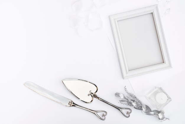 Free photo top view white frame with cutlery