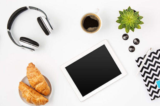 Top view of white office female workspace with laptop