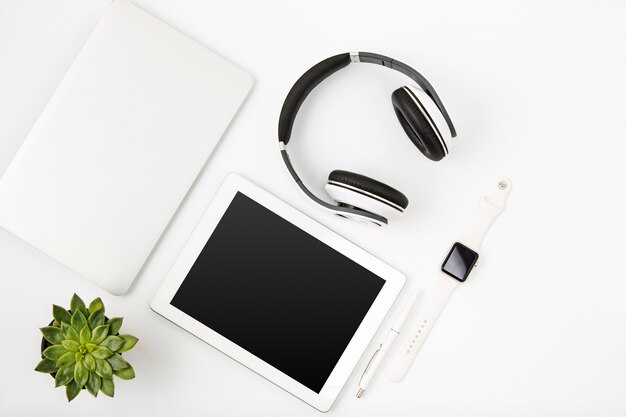 Top view of white office female workspace with laptop