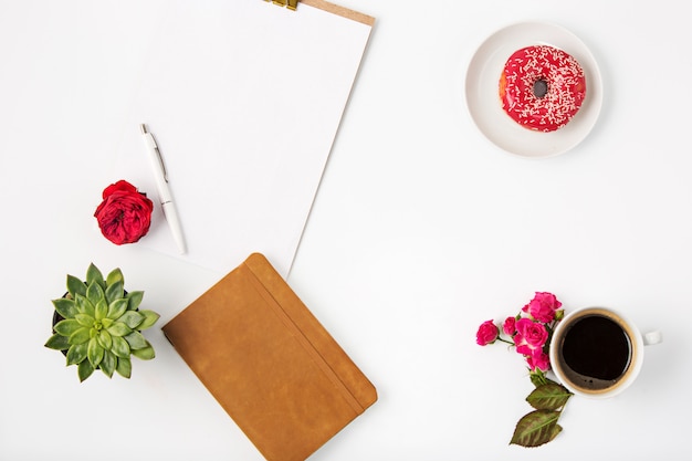 Free Photo top view of white office female workspace with notebook