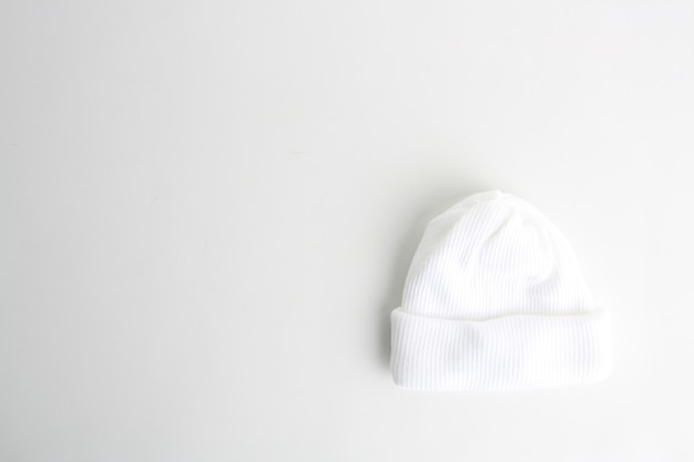 Free Photo top view of the white wool hat for babies