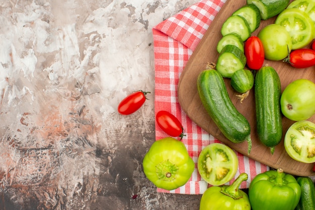 Top view of whole and chopped fresh vegetables