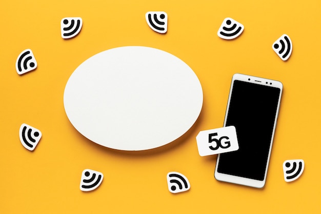 Free Photo top view of wi-fi symbols with smartphone and sim card