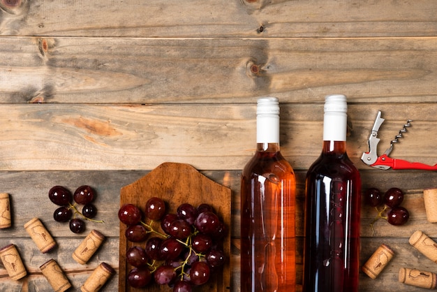 Top view wine bottles with wooden background