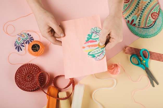 Top view of woman decorating card