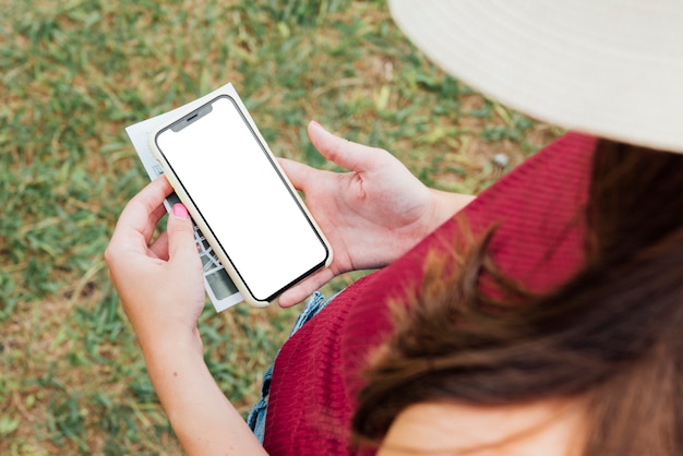 Top view of woman holding phone mock-up