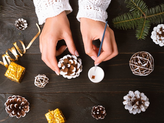 Top view of woman making christmas decorations