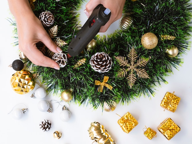 Free Photo top view of woman making christmas decorations