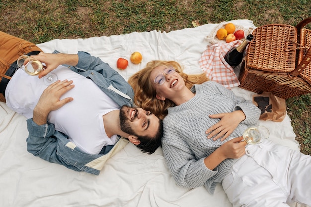 Top view woman and man having a picnic together