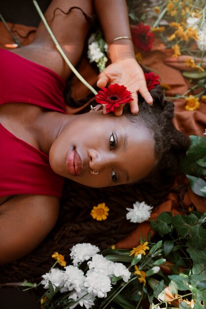 Top view woman posing in romantic garden