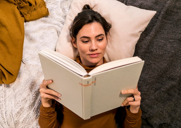 Top view woman reading a book