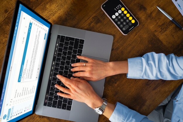 Top view woman typing on laptop