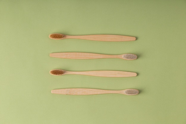 Free photo top view wooden brushes assortment