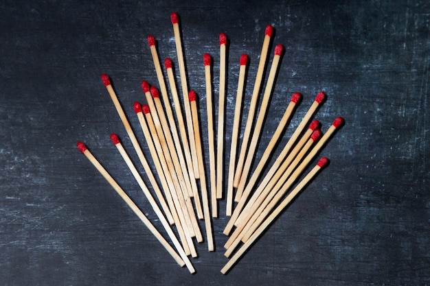 Free Photo top view wooden matches arrangement