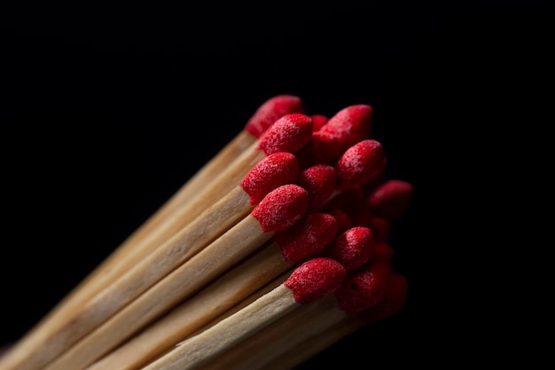 Free photo top view wooden matches with dark background