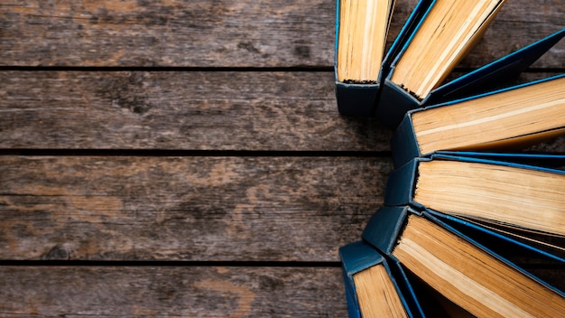 Free Photo top view of wooden table with books and copy space