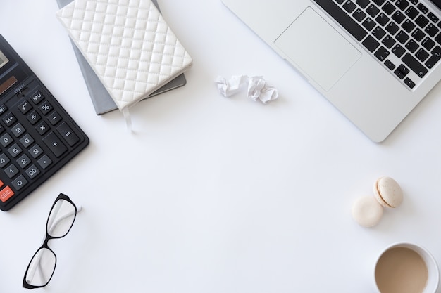 Top view of a working desk, female office supplies